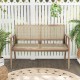 Teak wood garden bench with armrests and natural rattan backrest, perfect for patio or garden relaxation.