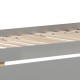 Twin over twin bunk bed frame in gray with wooden slats and two storage drawers for space-saving organization.