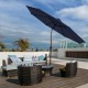 Dark blue 9-foot solar LED lighted patio umbrella with crank lift and tilt adjustment, perfect for outdoor relaxation.