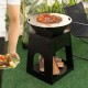 Patio fire pit with grill and ash box in black, featuring a firewood log rack for outdoor cooking and warmth.