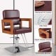 Hydraulic barber chair with red PVC surface, wooden armrests, and adjustable height for hairstylists.