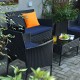 Single chair from the 4-piece patio rattan set with navy cushion, designed for stylish outdoor comfort and durability.