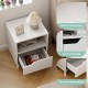 Mid Century Modern bedside table in white with wood grain finish, featuring a storage drawer and open shelf for.