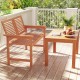 Outdoor wooden 2-person patio bench with slatted backrest, perfect for front porch or garden relaxation.