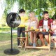 16-inch oscillating outdoor misting fan in black, providing cooling mist for backyard gatherings and patio comfort.