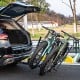 Tilt-able 2-inch hitch mount bike rack with two bikes secured, designed for easy trunk access and stability.