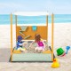 Kids sandbox with removable canopy, solid fir wood, sand wall, and built-in seats for outdoor play at the beach.
