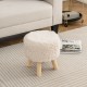 Round footstool ottoman with white faux fur upholstery and rubber wood legs, perfect for living room or bedroom use.
