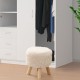 Round faux fur footstool with padded seat and rubber wood legs, perfect for living room or bedroom use.