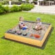 Wooden sandbox with kitchen playset accessories for kids, featuring solid fir wood and ample space for multiple.