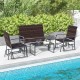 4-piece patio gliding set with brown wicker, tempered glass coffee table, ideal for poolside relaxation.
