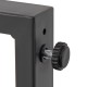 Close-up of the adjustable footpad on the heavy-duty metal frame of the brown patio gliding set for enhanced stability.