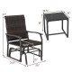 Patio gliding chair with brown rattan surface and tempered glass coffee table, perfect for backyard relaxation.