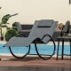 Single gray outdoor rocking lounge chair with removable headrest, showcasing its ergonomic seat and curved armrests for.