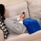Weighted electric heating pad in blue with massagers, providing soothing heat and comfort for relaxation on a couch.