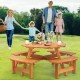 Round picnic table set in natural fir wood with slatted tops, perfect for outdoor meals with family and friends.