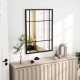 Stylish black metal framed wall mirror, 40 x 28 inches, perfect for enhancing rustic and modern decor in any room.