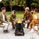 20-inch black patio fire pit with pot holder, surrounded by friends, perfect for camping and outdoor gatherings.