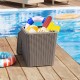 Outdoor resin storage side table with wicker-woven accent, filled with pool supplies, perfect for patio or poolside use.