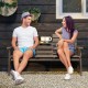 Outdoor fir wood bench with foldable middle table, gray, ideal for patio seating and relaxation for 2-3 people.