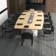 Ergonomic black reception chair with sled base and padded armrests, perfect for enhancing comfort in conference rooms.