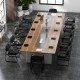 Black reception chairs with sled base and padded armrests, ideal for office or waiting room use, shown in a conference.