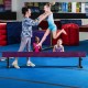 Adjustable 7.5 ft gymnastics beam in purple, featuring a non-skid surface, ideal for safe practice at various heights.