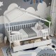 Twin House Bed in white with a charming roof design, featuring a cozy bedding setup and decorative pillows for a themed.