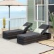 Patio wicker lounge chairs with adjustable backrests and gray cushions, perfect for outdoor relaxation by the pool.