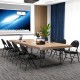 Padded folding chairs with a metal frame in black, ideal for meetings and events, featuring a convenient carry handle.