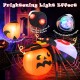 Inflatable spider on a pumpkin with LED and colorful rotating lights, perfect for Halloween backyard decoration.