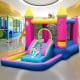 Inflatable princess bounce house with slide, ball pit, and safety net, made of durable oxford fabric for kids' fun.