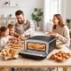 Indoor electric pizza oven in black with dual heating zones, ideal for 12-inch pizzas and family gatherings.