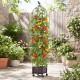 Indoor outdoor raised garden bed with trellis, featuring vibrant tomatoes, on wheels for easy mobility in any garden.
