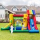 Rainbow inflatable bounce castle with double slides, climbing wall, and kids playing in backyard for outdoor fun.
