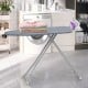 Ironing board with removable silver-gray cover, featuring an iron rest and foldable design for easy storage in laundry.