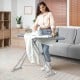 Ironing board with silver-coated cover, featuring a handy iron rest and foldable design for easy storage.