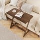 Z-shaped brown bamboo side table with spacious tabletop, ideal for snacks and laptops, perfect for small living spaces.