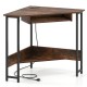 Triangle corner desk in rustic brown with charging station, keyboard tray, and bottom storage shelf for versatile use.
