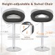 Height-adjustable black bar stool with hollow back, footrest, and 360-degree swivel for personalized comfort.