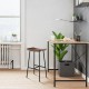 Industrial saddle bar stool with metal legs, contoured MDF seat, perfect for kitchen or dining room use.