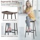 Industrial saddle bar stool with metal legs, featuring a contoured seat and footrest, ideal for kitchen or bar use.