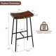Industrial saddle bar stool with metal legs, 29 inches tall, featuring a contoured MDF seat for kitchen or bar use.
