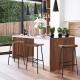 Industrial saddle bar stool with metal legs, contoured seat, perfect for kitchen or bar, showcasing modern charm.