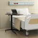 Height adjustable mobile standing desk in brown with lockable wheels, ideal for hospital or home use for working and.
