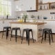 Set of 4 black Tolix style counter height barstools with stackable design, ideal for kitchen or home bar use.