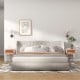 Modern bedside table with solid wood legs and rattan front panel, ideal for bedroom or living room storage.