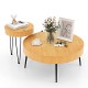 Round wooden coffee tables with metal legs, featuring a radial pattern, perfect for cups and decor in any style.