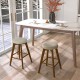 Backless swivel barstools with beige linen fabric seats and rubber wood legs, perfect for counter height tables.