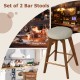 Set of 2 backless swivel bar stools with beige linen fabric seats and rubber wood legs, perfect for kitchen or dining.